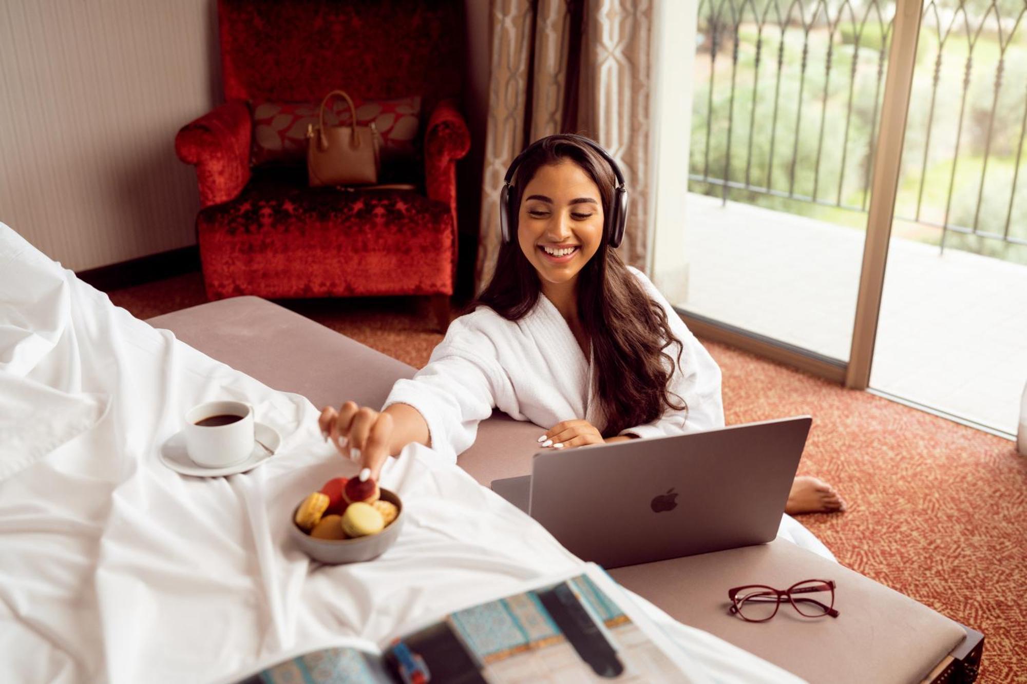 Palais Medina Riad Resort Fes Exterior photo A woman using a laptop